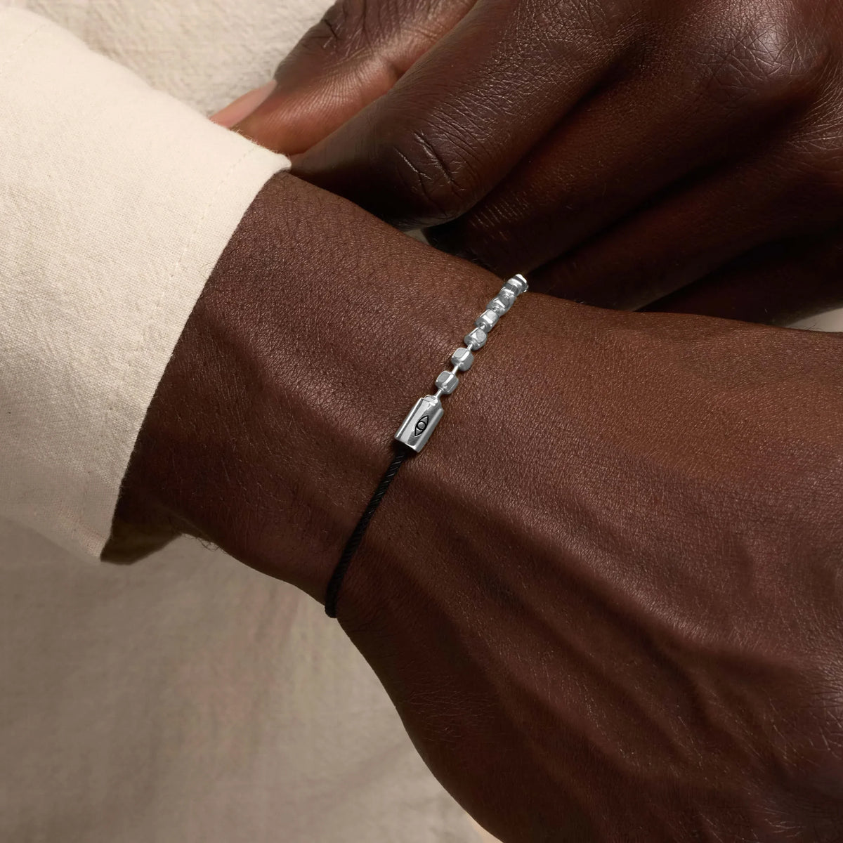 Continuous Renewal Silver Evil Eye Black String Bracelet